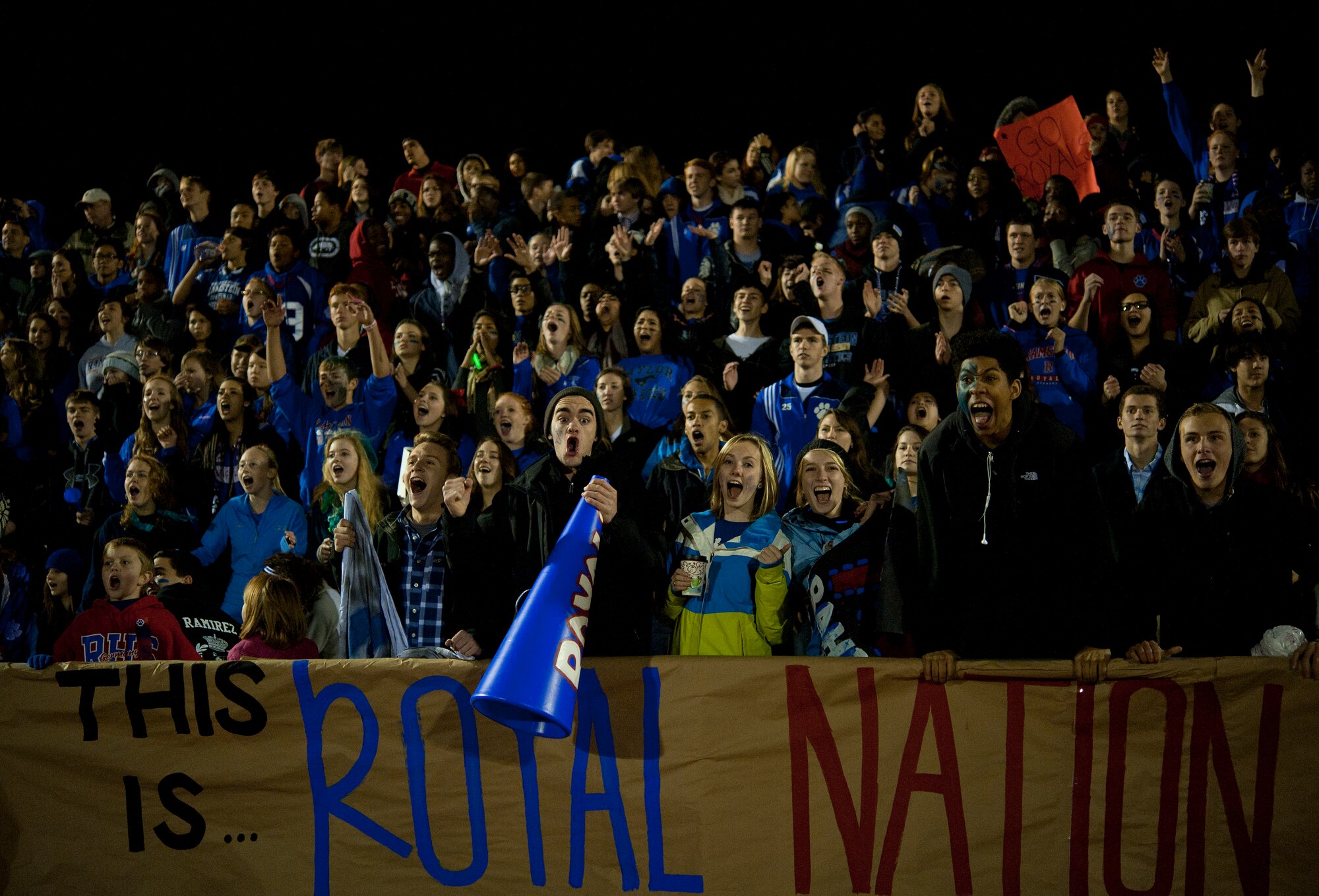 Ramstein Royal fans cheer for their team during the Department of Defense Dependents Schools Europe Division 1 football championship game Nov. 2, 2013, Kaiserslautern, Germany. After an undefeated season, the Royals lost 38-21 to the Wiesbaden Warriors. (U.S. Air Force photo/Senior Airman Damon Kasberg)