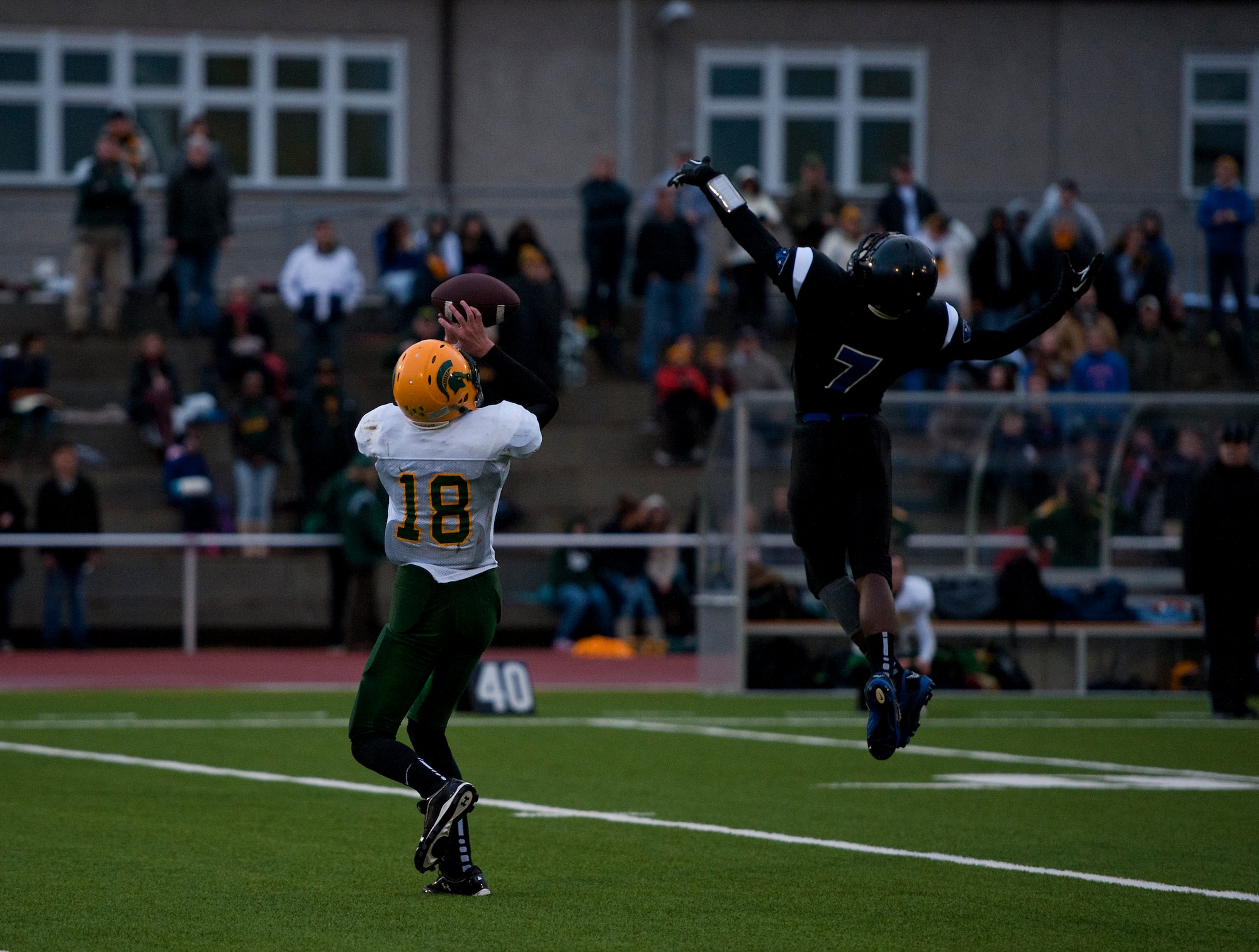 SHAPE Spartan’s quarterback playing as a wide receiver, Austin Stephens, catches the football during the Department of Defense Dependents Schools Europe Division 2 football championship game against the Hohenfel Tigers Nov. 2, 2013, Kaiserslautern, Germany. The Tigers won 38-35, after being down 17 points in the fourth quarter. (U.S. Air Force photo/Senior Airman Damon Kasberg)