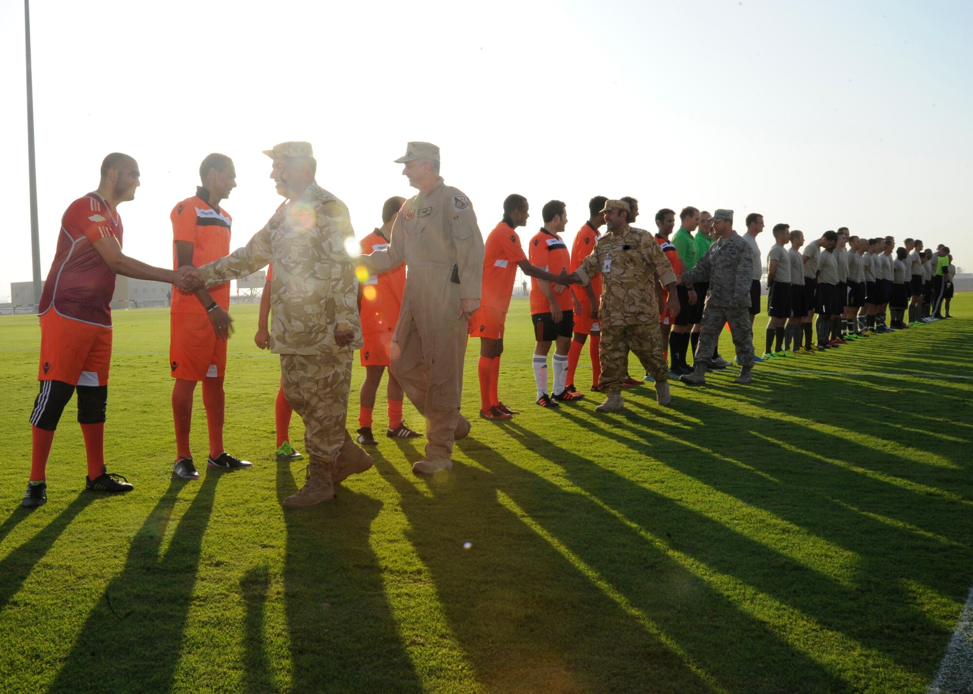 379th Air Expeditionary Wing and host nation leaders greet players representing the U.S. Air Force and the host nation’s military during the Friendship Games soccer tournament at the 379th AEW in Southwest Asia, Oct. 31, 2013. The games were held at the local military compound’s soccer stadium, and hosted by the local base commander Brig. Gen. Abdulla Jassim Al Meraikhi. (U.S. Air Force photo/Senior Airman Bahja J. Jones)  
