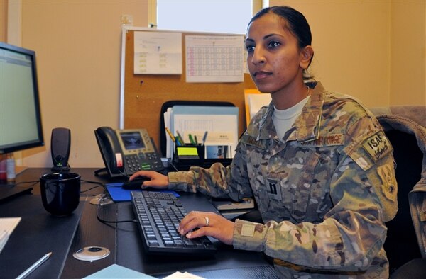 Air Force Capt. Dimple Nolly, 455th Air Expeditionary Wing deputy staff judge advocate, works in her office at Bagram Airfield, Afghanistan, Oct. 29, 2013. U.S. Air Force photo by Tech. Sgt. Rob Hazelett 
