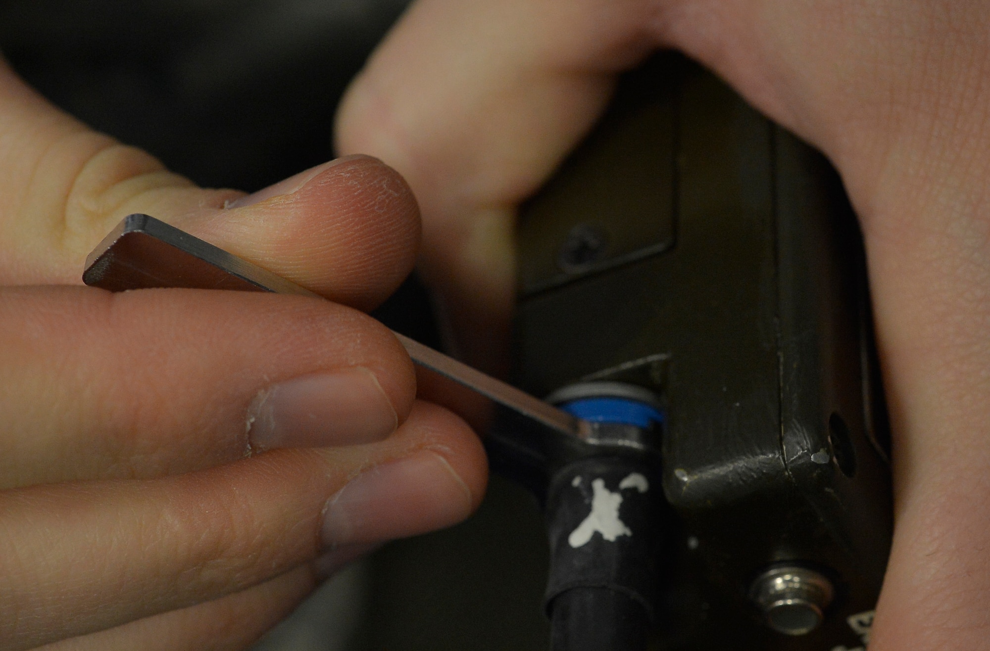 Airman 1st Class Mitchell Lagan, 86th Operational Support Squadron aircrew flight equipment technician, repairs a radio utilized in survival vests, Nov. 7, 2013, Rasmtein Air Base, Germany. Lagan and other AFE Airmen are responsible for ensuing survival equipment is operational in order to provide aircrews with necessary equipment in order sustain their lives during a wide variety of emergency situations. (U.S. Air Force photo/Airman 1st Class Jordan Castelan)