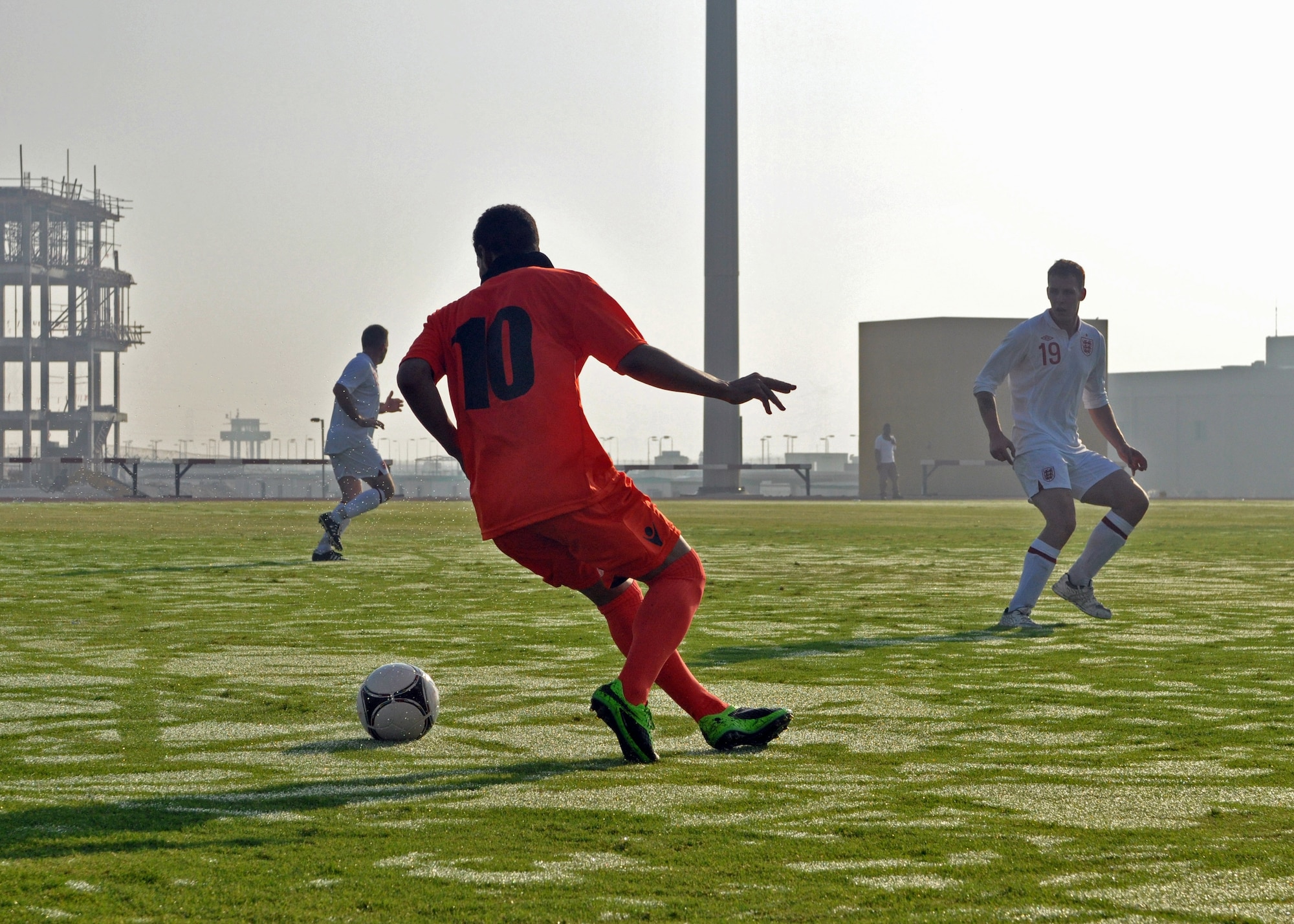 Host nation and Royal Air Force service members faceoff during a Friendship Games tournament soccer match at the 379th Air Expeditionary Wing in Southwest Asia Oct. 27, 2013. The tournament was a friendly illustration of the partnership between the United States, the United Kingdom, and the local military counterparts on the base. (U.S. Air Force photo/1st Lt. Susan Harrington)