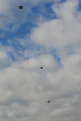 Airman from the 435th Contingency Response Group jumps out of a C-130J Super Hercules during a theater security cooperation event, Oct. 24, 2013, Powidz Air Transport Base, Poland. Generally, jumpers are used to secure and protect a new landing zone prior to aircraft landing. (U.S. Air Force photo/Senior Airman Hailey Haux)
