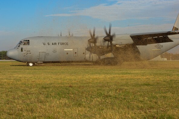 Pilots from the 37th Airlift Squadron prepare a C-130J Super Hercules for take-off during grass landing training, Oct. 23, 2013, Powidz Air Transport Base, Poland. Practicing grass landings is an essential part of staying mission ready for pilots. Grass landings occur when there is no constructed runway for aircraft to land in a required area.  (U.S. Air Force photo/Senior Airman Hailey Haux)