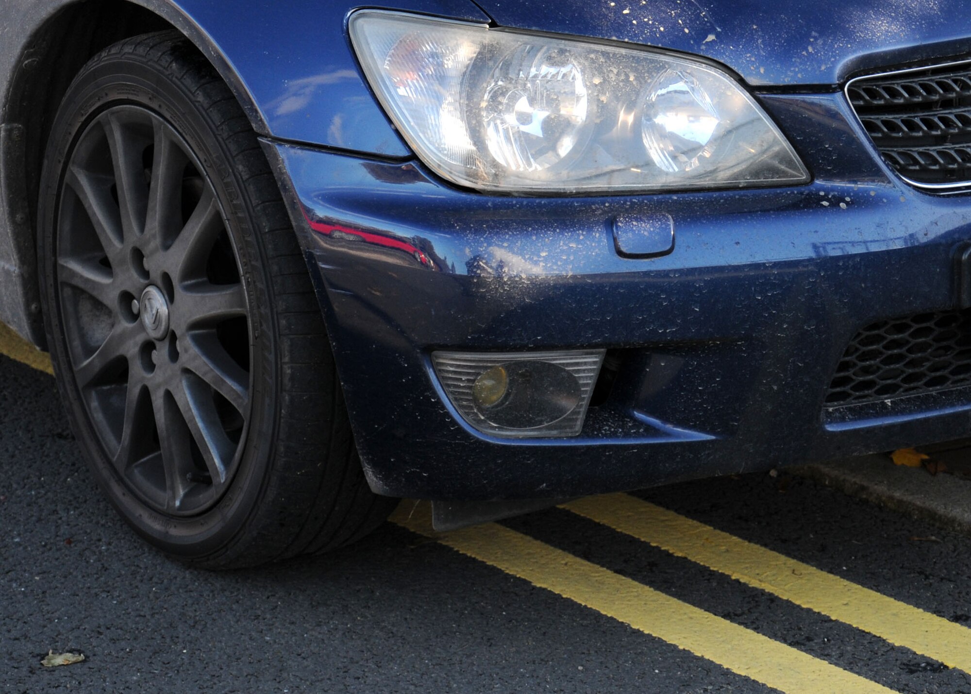 A parent of a child attending the RAF Mildenhall Youth Center leaves a car illegally parked on double yellow lines in the parking lot Oct. 23, 2013, in the YC parking lot on RAF Mildenhall, England. There are times in the day when parking becomes congested. The busy times are from 4:30 to 7 p.m. when service members finish work and collect their children before heading home. (U.S. Air Force photo by Gina Randall/Released)