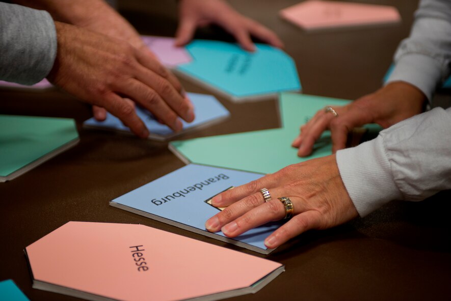 A Community Quest team put together a map of Germany puzzle Nov. 6, 2013, Ramstein Air Base, Germany. The puzzle was the first of nine challenges and needed to be complete to receive a clue to where the next challenge would be. (U.S. Air Force photo/Senior Airman Jonathan Stefanko)