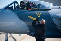 Dave Youtsey, Airborne Tactical Advantage Company pilot, gives a thumbs up to Bryan Hoy, ATAC maintenance technician, as he fires up his Hawker Hunter before playing the role of the “bad guy” for a Max Thunder sortie at Kunsan Air Base Republic of Korea, Nov. 7, 2013. During the 11th Max Thunder, the Airborne Tactical Advantage Company played the role of the opposition force challenging Airmen in a variety of scenarios. The ATAC Hawker Hunters were pitted against the combined force that employed 8th Fighter Wing F-16 Fighting Falcons, 51st Fighter Wing A-10 Thunderbolts II and F-16s, Marine Air Group 12 F-18 Hornets, AV-8B Harriers II, 35th Air Defense Artillery Brigade, 18th Wing E-3B Sentries, numerous ROKAF aircraft and accompanying support personnel during the two-week exercise. (U.S. Air Force photo by Senior Airman Armando A. Schwier-Morales/Released)