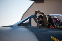 Dave Youtsey, Airborne Tactical Advantage Company pilot, represents his old squadron before playing the role of the “bad guy” for a Max Thunder sortie at Kunsan Air Base Republic of Korea, Nov. 7, 2013. During the 11th Max Thunder, the Airborne Tactical Advantage Company played the role of the opposition force challenging Airmen in a variety of scenarios. The ATAC Hawker Hunters were pitted against the combined force that employed 8th Fighter Wing F-16 Fighting Falcons, 51st Fighter Wing A-10 Thunderbolts II and F-16s, Marine Air Group 12 F-18 Hornets, AV-8B Harriers II, 35th Air Defense Artillery Brigade, 18th Wing E-3B Sentries, numerous ROKAF aircraft and accompanying support personnel during the two-week exercise. (U.S. Air Force photo by Senior Airman Armando A. Schwier-Morales/Released)