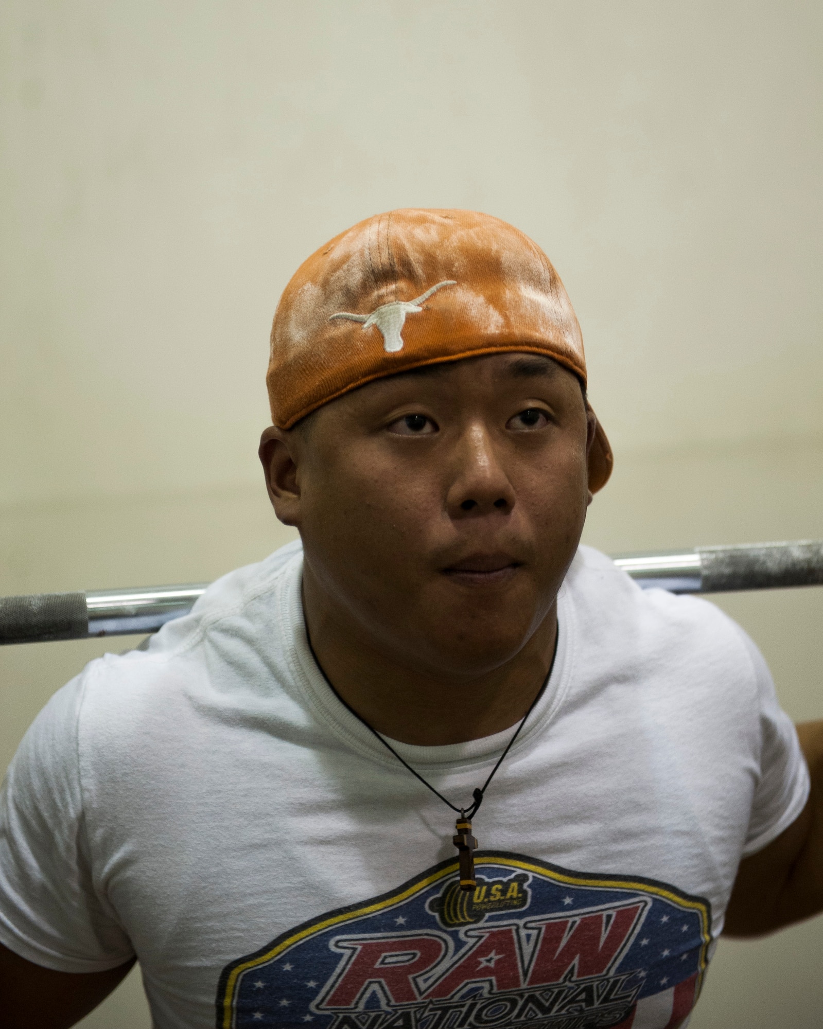 Airman 1st Class Benny Le, 8th Security Forces Squadron response force leader, prepares to squat at Kunsan Air Base, Republic of Korea fitness center. Le is a member of the Air Force Powerlifting Team and hopes to improve his max weight for his next competition. (U.S. Air Force photo by Senior Airman Clayton Lenhardt/Released)