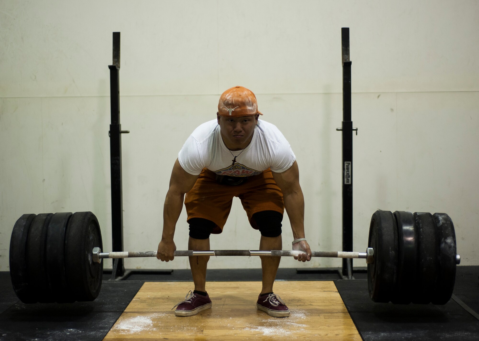 Airman 1st Class Benny Le, 8th Security Forces Squadron response force leader, performs deadlifts while training at Kunsan Air Base, Republic of Korea fitness center. Le started lifting in high school and is now a member of the Air Force Powerlifting Team. (U.S. Air Force photo by Senior Airman Clayton Lenhardt/Released)
