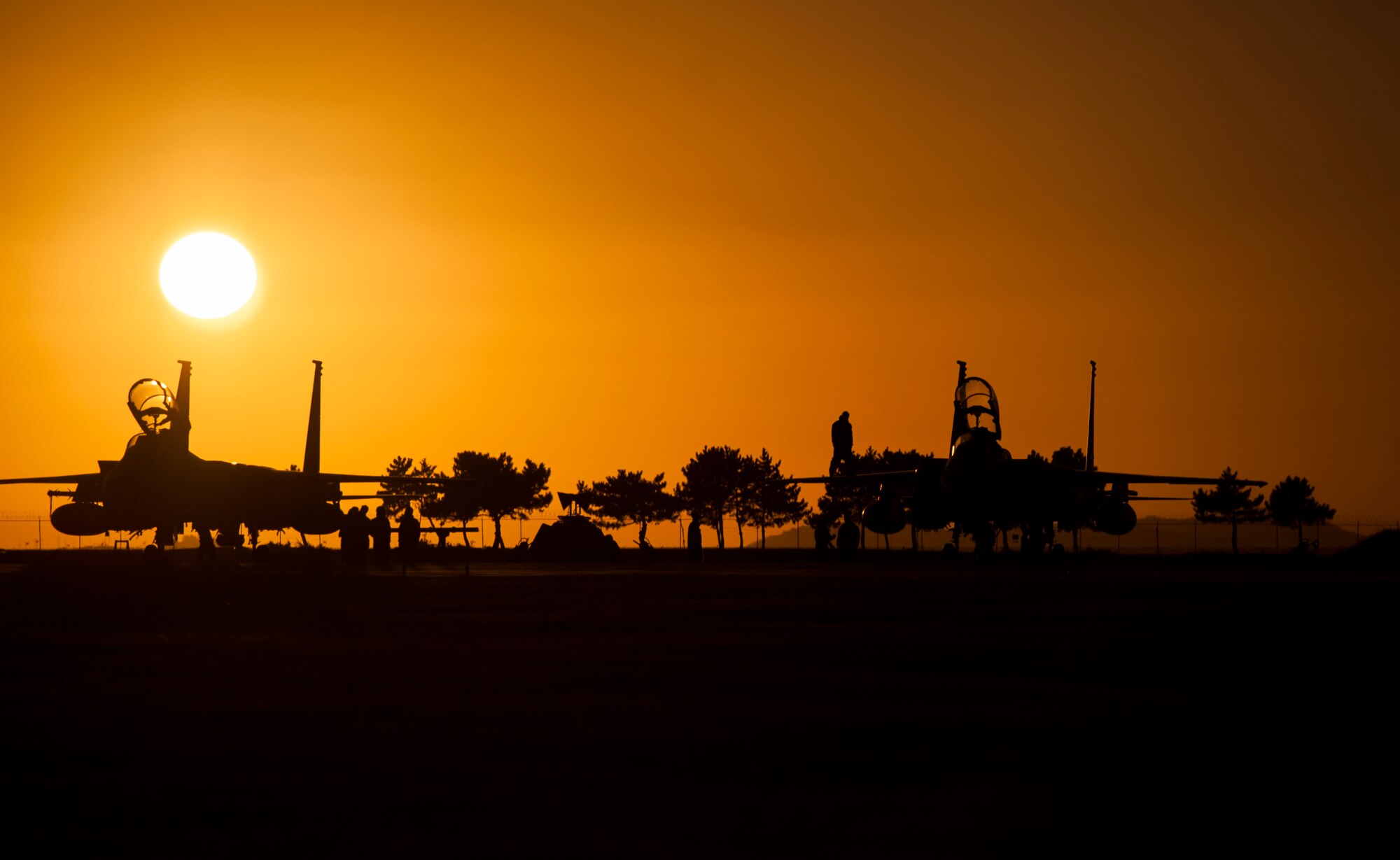 Republic of Korea airmen inspect F-15 Slam Eagles after their final Max Thunder sortie at Kunsan Air Base, Republic of Korea, Nov. 7, 2013. Airmen from the U.S. Air Force, Marine Corps and the Republic of Korea air force continued their participation in scenarios and planning cycles in a robust exercise setting that simulated combined operations against a hostile force, Nov. 7, 2013. This combined large-force employment exercise includes 8th Fighter Wing F-16 Fighting Falcons, 51st Fighter Wing A-10 Thunderbolts II and F-16s, Marine Air Group 12 F-18 Hornets, AV-8B Harriers II, 35th Air Defense Artillery Brigade, 18th Wing E-3B Sentries, numerous ROKAF aircraft and accompanying support personnel.  (U.S. Air Force photo by Senior Airman Armando A. Schwier-Morales/Released)