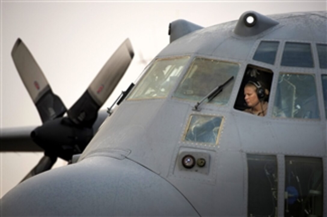 U.S. Air Force Maj. Erin Kelley performs a preflight check on a C-130H Hercules before embarking on a retrograde mission to Baghdad International Airport, Iraq, on Oct. 28, 2013.  Kelley is deployed from the 176th Wing of the Alaska Air National Guard and is attached to the 737th Expeditionary Airlift Squadron.  