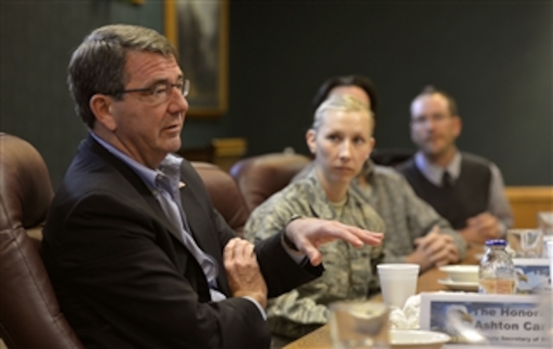Deputy Secretary of Defense Ashton B. Carter, left, talks with a group of service members and civilians after a lunch at the dining facility at Hill Air Force Base in Ogden, Utah, on Nov. 5, 2013.  