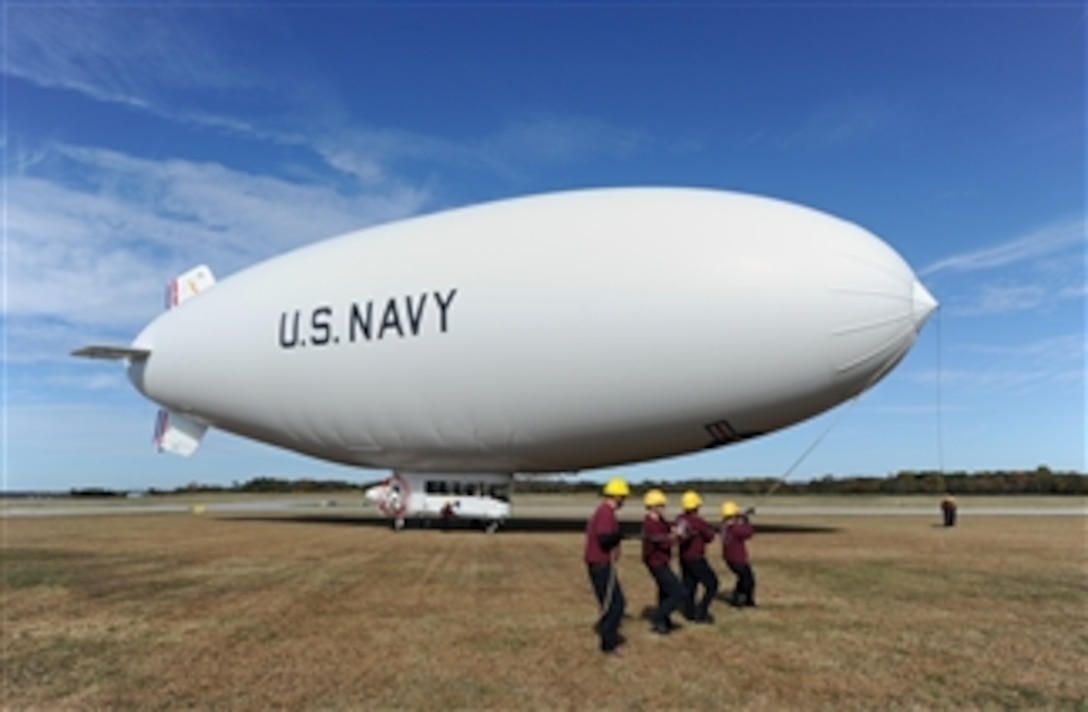 Handlers prepare to launch the U.S. Navy MZ-3A manned airship for an orientation flight from Naval Air Station Patuxent River, Md., on Nov. 6, 2013.  The MZ-3A is assigned to Scientific Development Squadron 1 of the U.S. Naval Research Laboratory Military Support Division. The Navy blimp is an advanced flying laboratory that is being used to evaluate affordable sensor payloads and provide support for related naval research projects.  