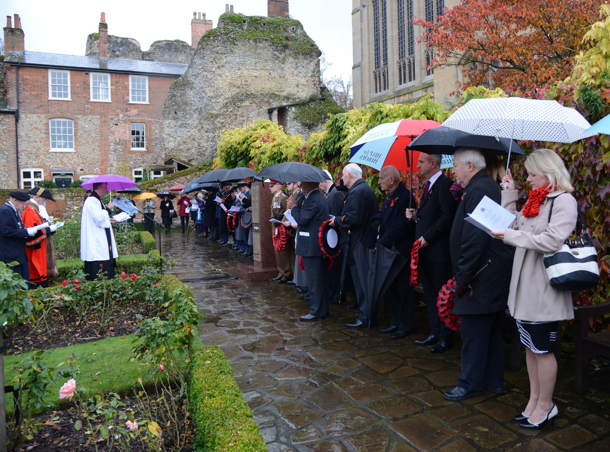 Remembrance Day ceremony participants pay their respects Nov. 9, 2013, in Bury St. Edmunds in Suffolk, England. Remembrance Day is held in November to honor members of the armed forces who have lost their lives in the line of duty. Each year, on the second Sunday of November, U.K. citizens pay homage to those who died in the two world wars and other military conflicts. (U.S. Air Force photo by Airman 1st Class Kelsey Waters/Released)