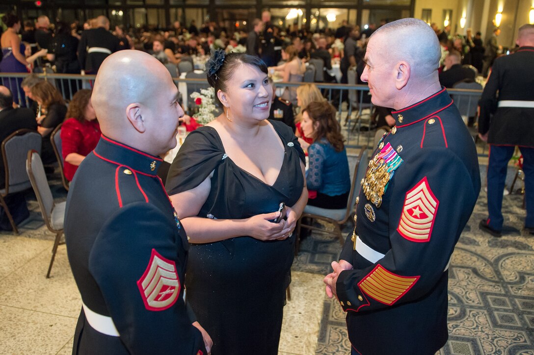 Marine Corps Sgt. Maj. Bryan B. Battaglia, senior enlisted advisor to the chairman of the Joint Chiefs of Staff, speaks with a Marine and his guest during the Marine Detachment Dam Neck's celebration for the Marine Corps' 238th birthday in Virginia Beach, Va., Nov. 8, 2013.
