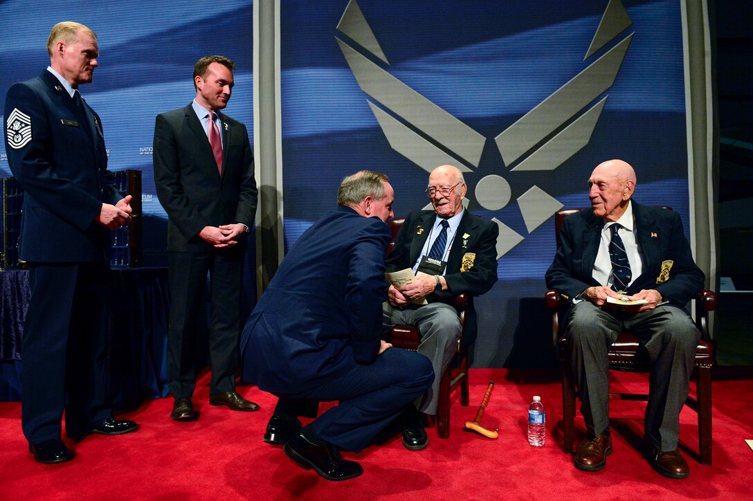 Chief Master Sgt. of the Air Force James A. Cody, left, Acting Secretary of the Air Force Eric Fanning and Chief of Staff of the Air Force Gen. Mark A. Welsh III speak to The Doolittle Raiders after their final toast at the National Museum of the U.S. Air Force Nov. 09, 2013 in Dayton, Ohio.
