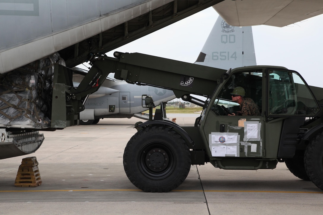 Lance Cpl. Elijah L. Gates loads a pallet of gear onto a KC-130J Hercules aircraft Nov. 10 at Marine Corps Air Station Futenma, Okinawa, Japan, during preparation for a humanitarian assistance and disaster relief mission to the Philippines. Super Typhoon Haiyan has impacted more than 4.2 million people across 36 provinces in the Philippines, according to the Philippine government’s national disaster risk reduction and management council.  Philippine officials will have a better idea of the damage and death toll in the coming days as transportation and communications systems are repaired. MCAS Futenma is a mission ready air station capable of continuous aviation and base operating support for tenant organizations and follow-on U.S., Allied, and United Nations forces during combat or contingency operations in the Western Pacific Theater of operations, to include U.S. Pacific Command, Marine Corps Forces Pacific and Marine Corps Installations Pacific.