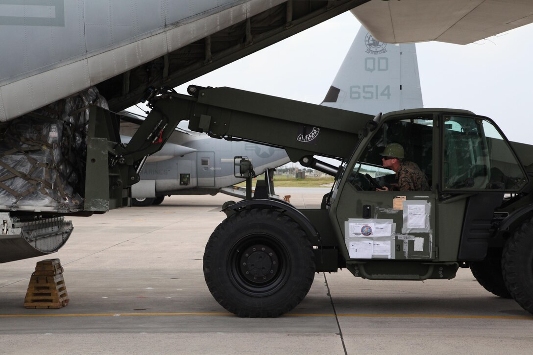 Lance Cpl. Elijah L. Gates loads a pallet of gear onto a KC-130J Hercules aircraft Nov. 10 at Marine Corps Air Station Futenma, Okinawa, Japan, during preparation for a humanitarian assistance and disaster relief mission to the Philippines. Super Typhoon Haiyan has impacted more than 4.2 million people across 36 provinces in the Philippines, according to the Philippine government’s national disaster risk reduction and management council.  Philippine officials will have a better idea of the damage and death toll in the coming days as transportation and communications systems are repaired. MCAS Futenma is a mission ready air station capable of continuous aviation and base operating support for tenant organizations and follow-on U.S., Allied, and United Nations forces during combat or contingency operations in the Western Pacific Theater of operations, to include U.S. Pacific Command, Marine Corps Forces Pacific and Marine Corps Installations Pacific.