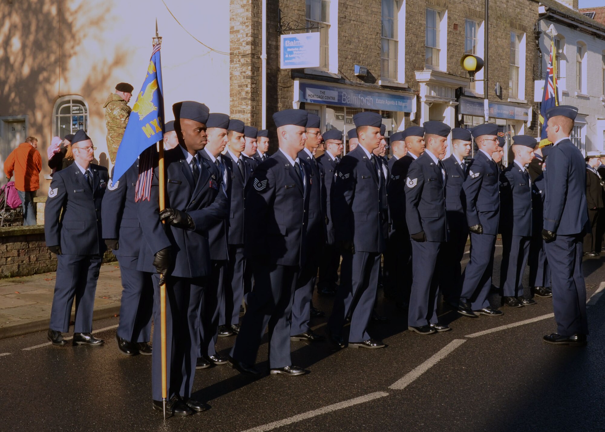 U.S. Air Force Airmen from RAF Mildenhall stand in formation during a Remembrance Day ceremony Nov. 10, 2013, in Mildenhall in Suffolk, England. Remembrance Day is held in November each year to honor members of the armed forces who have died in the line of duty. Each year, on the second Sunday of November, U.K. citizens pay homage to those who died in the two world wars and other military conflicts. (U.S. Air Force photo by Airman 1st Class Jonathan Light/Released)