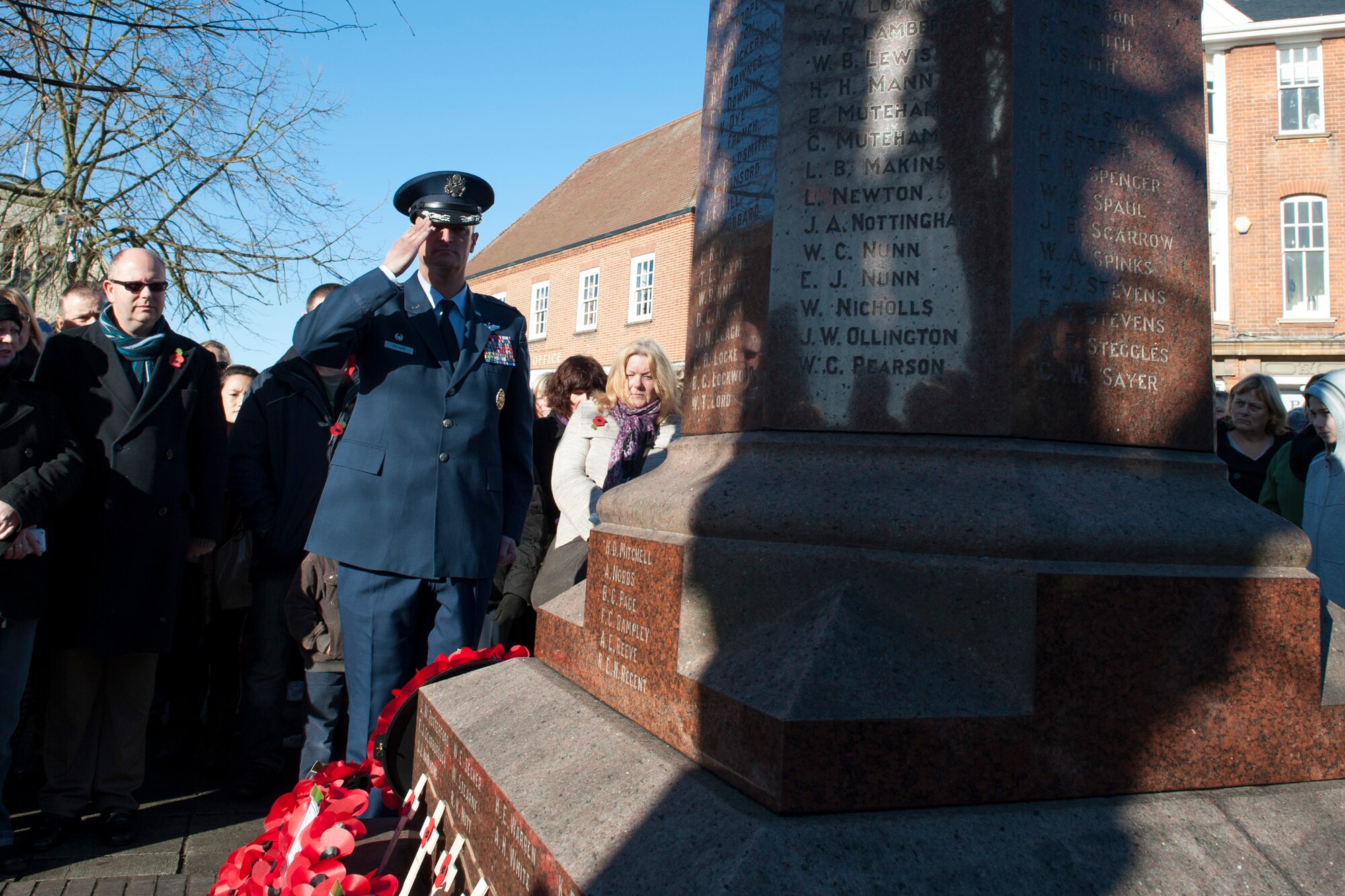 U.S. Air Force Col. Christopher Ireland, 352nd Special Operations Group commander, salutes after laying a wreath during a Remembrance Day ceremony Nov. 10, 2013, in Thetford, England. The poppy was chosen as the symbol of remembrance because many British soldiers lost their lives in the poppy fields of Flanders, Belgium, during World War I. The day was originally named Armistice Day after World War I, which ended at the 11th hour on the 11th day of the 11th month in 1918. The day was changed to Remembrance Day after World War II to honor all of the men and women who serve. (U.S. Air Force photo by Staff Sgt. Stephen Linch/Released)