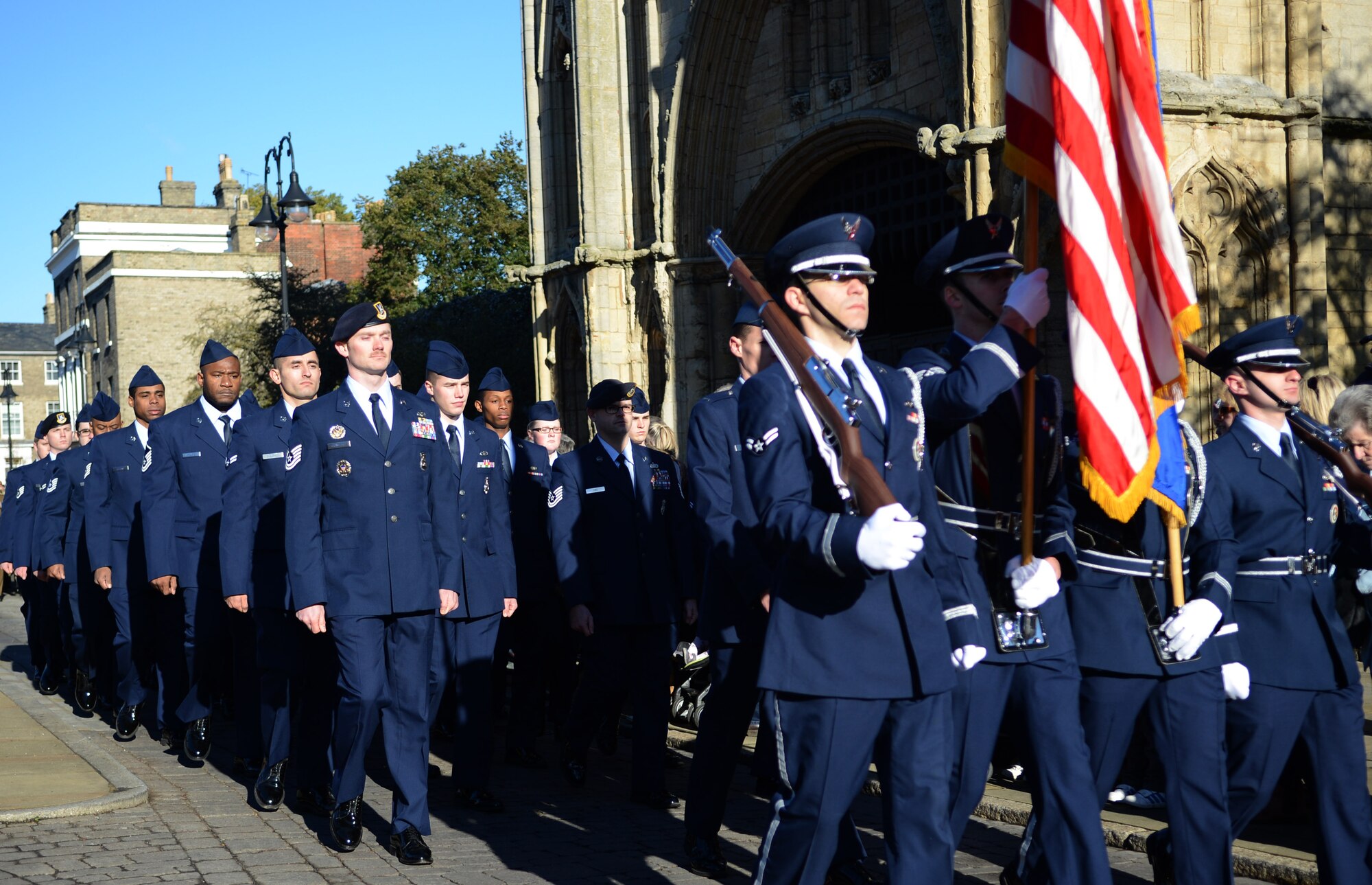 U.S. Air Force Airmen from RAF Mildenhall and RAF Lakenheath march in a Remembrance Day parade Nov. 10, 2013, in Bury St. Edmunds in Suffolk, England. The parade participants also included members of the Royal Air Force, civic leaders, military cadets and others. Each year, on the second Sunday of November, U.K. citizens pay homage to those who died in the two world wars and other military conflicts. (U.S. Air Force photo by Airman 1st Class Dillon Johnston/Released)