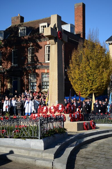 Poppy wreaths rest against the base of a war memorial during a Remembrance Day ceremony Nov. 10, 2013, in Bury St. Edmunds in Suffolk, England. The poppy was chosen as the symbol of remembrance because many British soldiers lost their lives in the poppy fields of Flanders, Belgium, during World War I. (U.S. Air Force photo by Airman 1st Class Kyla Gifford/Released)