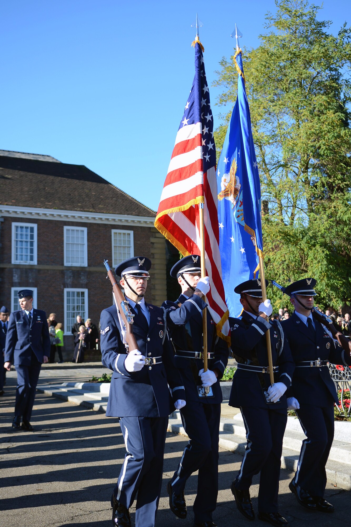 U.S. Air Force Airmen from the RAF Lakenheath Honor Guard march during a Remembrance Day ceremony Nov. 10, 2013, in Bury St. Edmunds in Suffolk, England. Remembrance Day is held in November each year to honor members of the armed forces who have died in the line of duty. The day was originally named Armistice Day after World War I, which ended at the 11th hour on the 11th day of the 11th month in 1918. The day was changed to Remembrance Day after World War II to honor all of the men and women who serve. (U.S. Air Force photo by Airman 1st Class Kyla Gifford/Released)