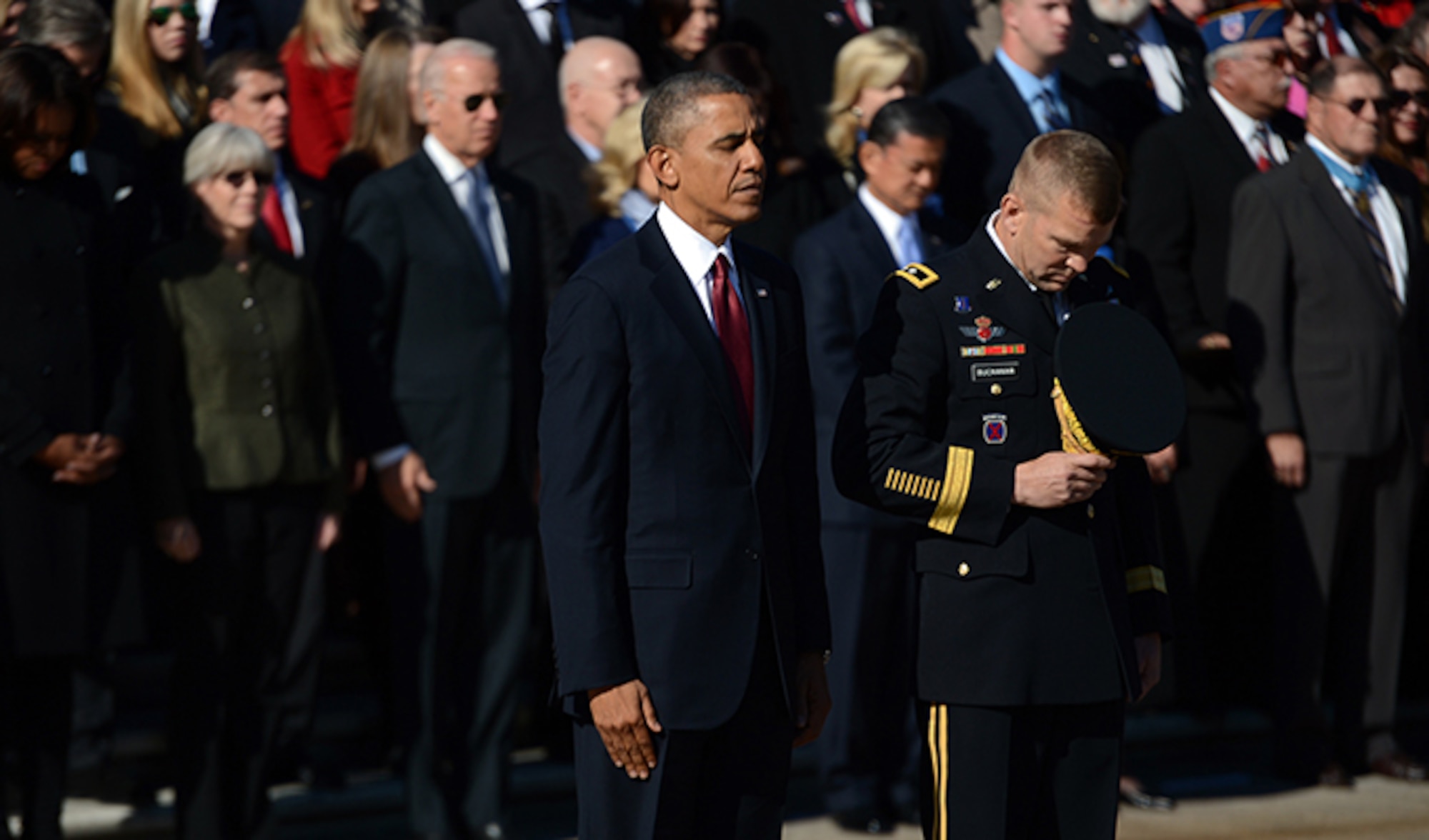 President Barack Obama, left, stands at the Tomb of the Unknown Soldier Nov. 11, 2013, while Maj. Gen. Jeffrey S. Buchanan bows his head during a Veterans Day wreath laying ceremony at Arlington National Cemetery in Arlington, Va. Buchanan is the commander of U.S. Army Military District of Washington. (Department of Defense photo/EJ Hersom)