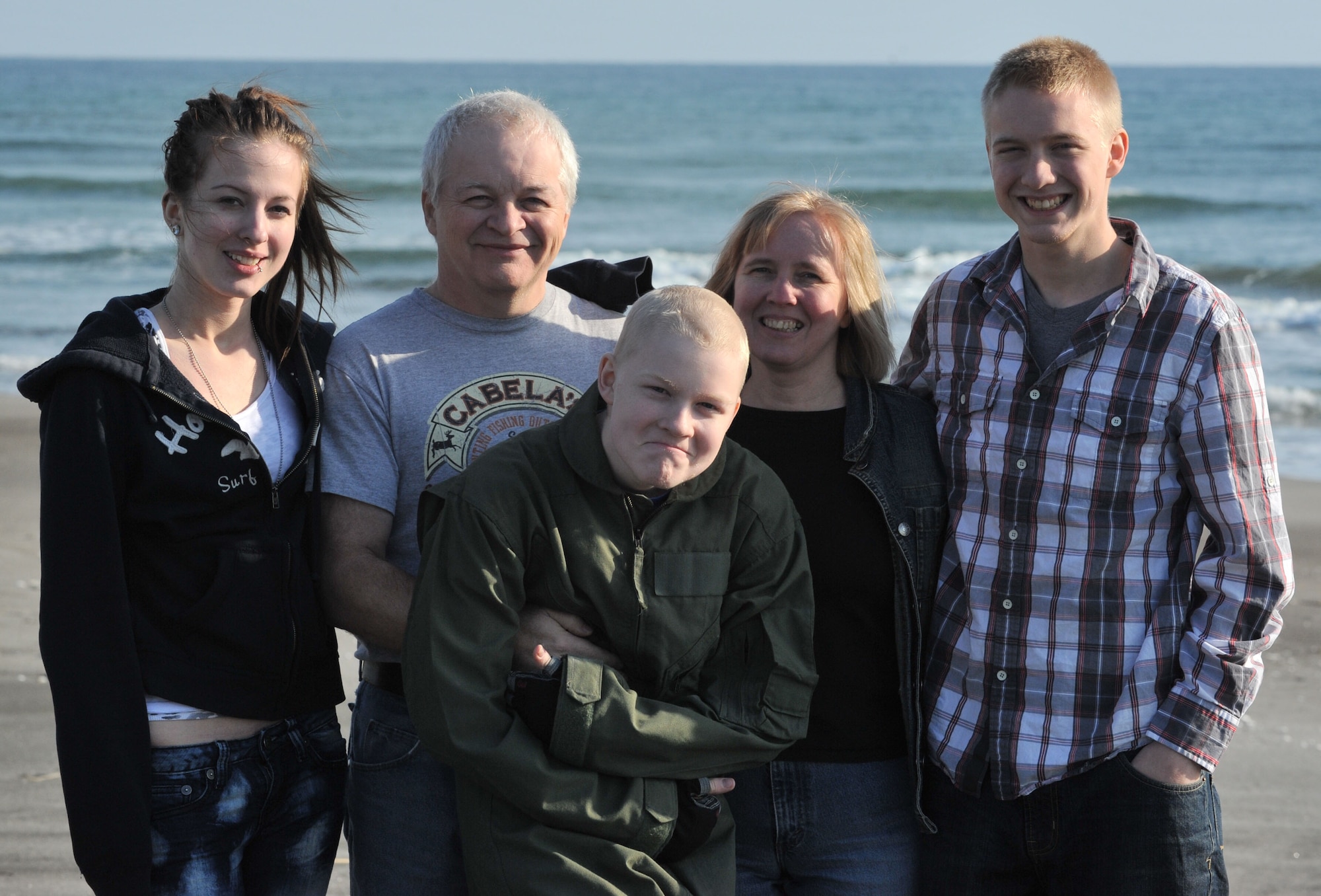The Skrove family, Shanna, Jeff, Jonah, Sarah and Jared, reunited Oct. 31, 2013, at Misawa Air Base, Japan, after 10 months of separation. The reunion was made possible by the Make-A-Wish Foundation, which granted Jonah’s wish to see his brother. Every 38 minutes the Make-A-Wish Foundation grants the wish of a 3- to 17-year-old child who is battling a life-threatening illness.  (U.S. Air Force photo by Staff Sgt. Alyssa C. Wallace/released)