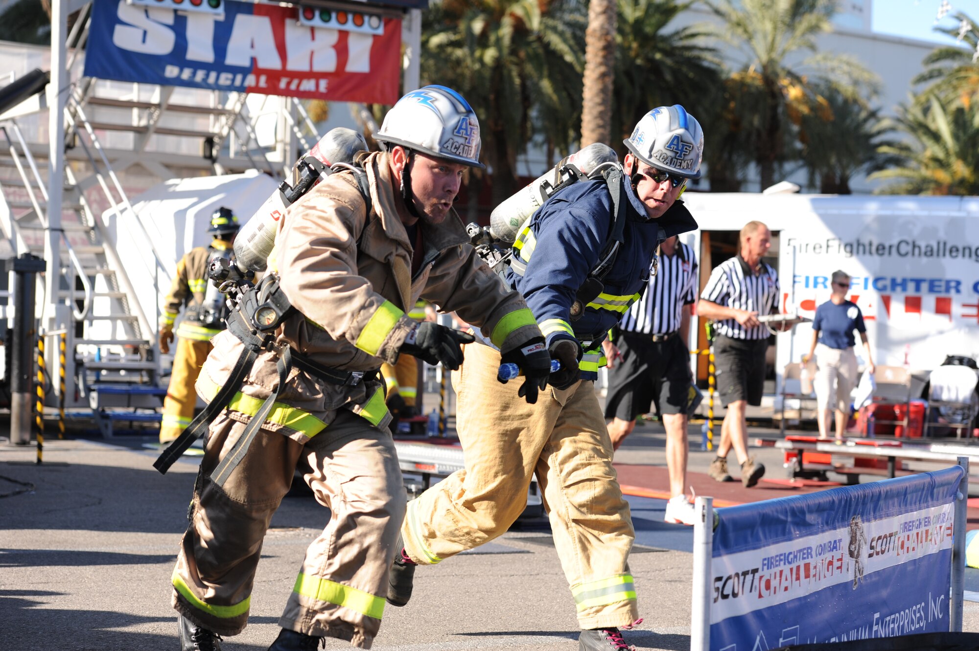 10th Civil Engineer Squadron fire department firefighter Roy Dalton (left) takes the baton from 10th CES fire chief Ken Helgerson during a relay event at the World Firefighter Combat Challenge in Las Vegas, Oct. 22- Oct. 27. Dalton is a 10th CES Fire Department station captian. 