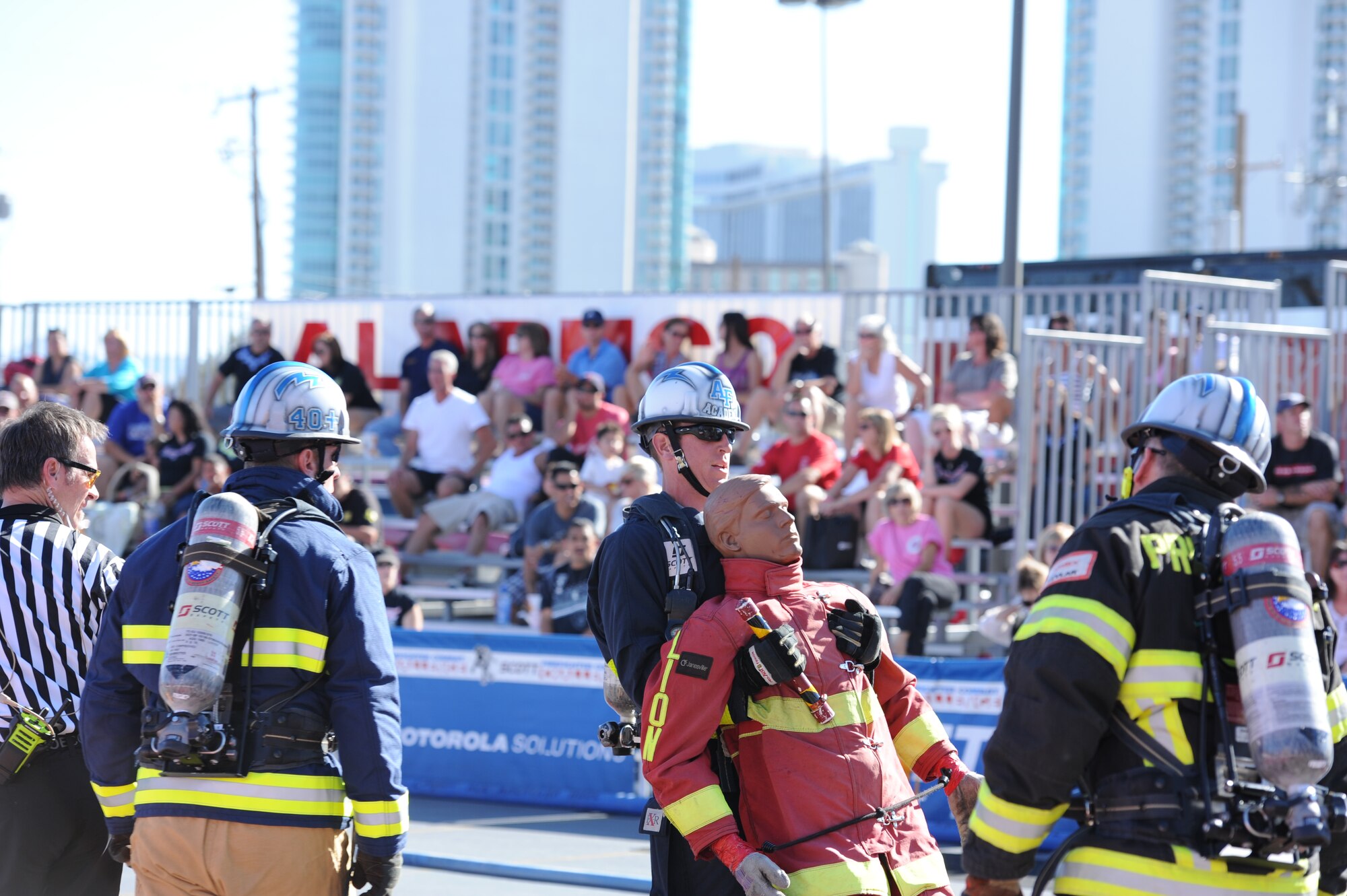 10th Civil Engineer Squadron firefighter Bill Gates drags a 175-pound rescue dummy at the World Firefighter Combat Challenge course's final event while 10th CES assistant fire chief Ron Prettyman cheers him on. The competition was held Oct. 22-Oct. 27 in Las Vegas.