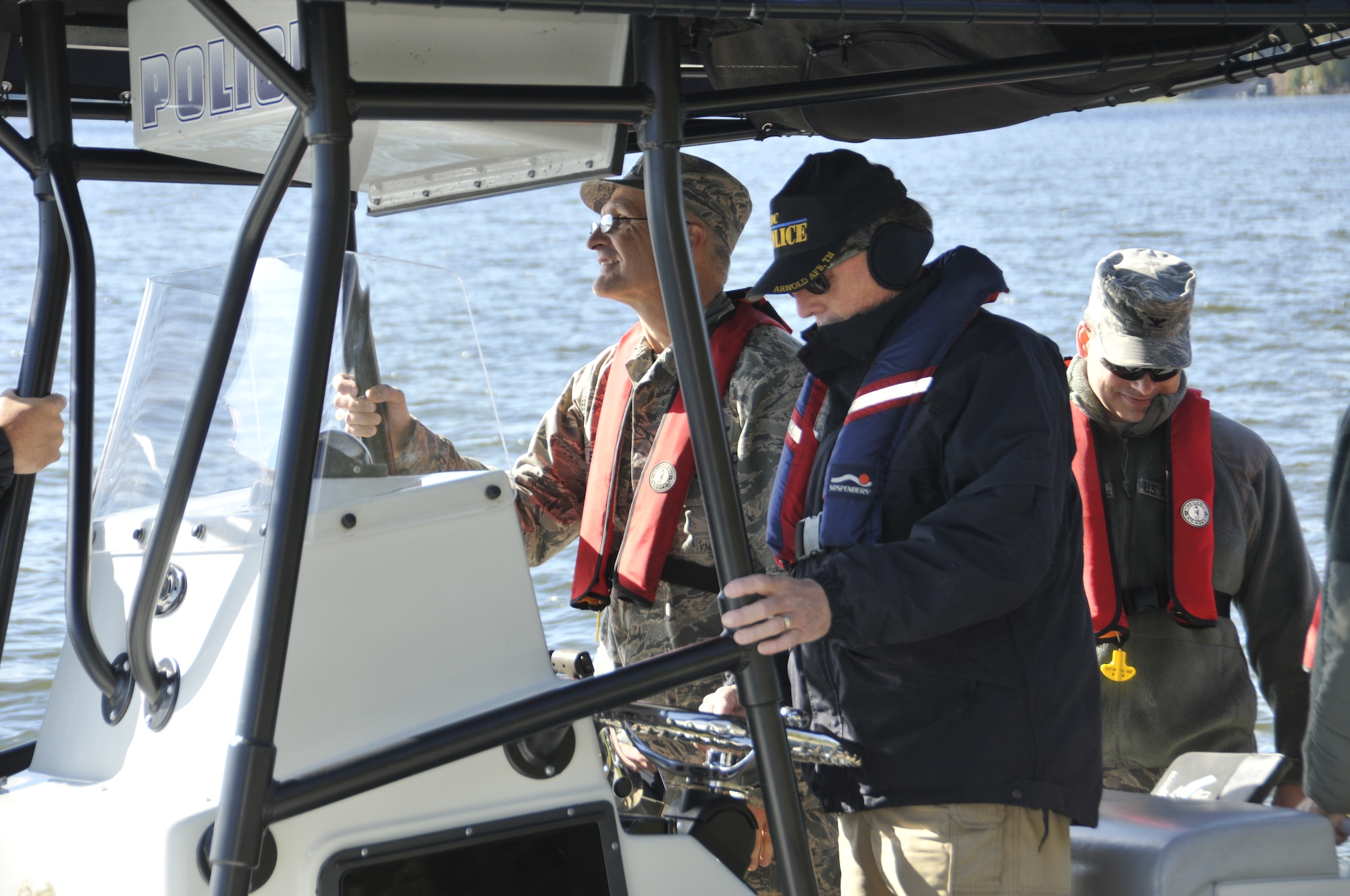 Maj. Gen. Arnold W. Bunch, Jr. (far left) takes a tour of the AEDC lake during a recent visit.  The two-star general spent four days at the Complex during October.  Since oversight of AEDC is part of his responsibilities, Bunch tries to make regular, routine visits to middle Tennessee.  Also pictured:  Arnold Operations Captain Kevin Syler (middle) and AEDC Commander Col. Raymond Toth. 