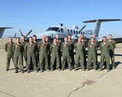 Members of the 427th Reconnaissance Squadron pose for a picture in front of a MC-12W liberty aircraft on Beale Air Force Base, Calif., Oct. 31, 2013. The pictured crew collectively has more than 20,000 combat hours flying the liberty. (U.S. Air Force photo by John Schwab/Released)