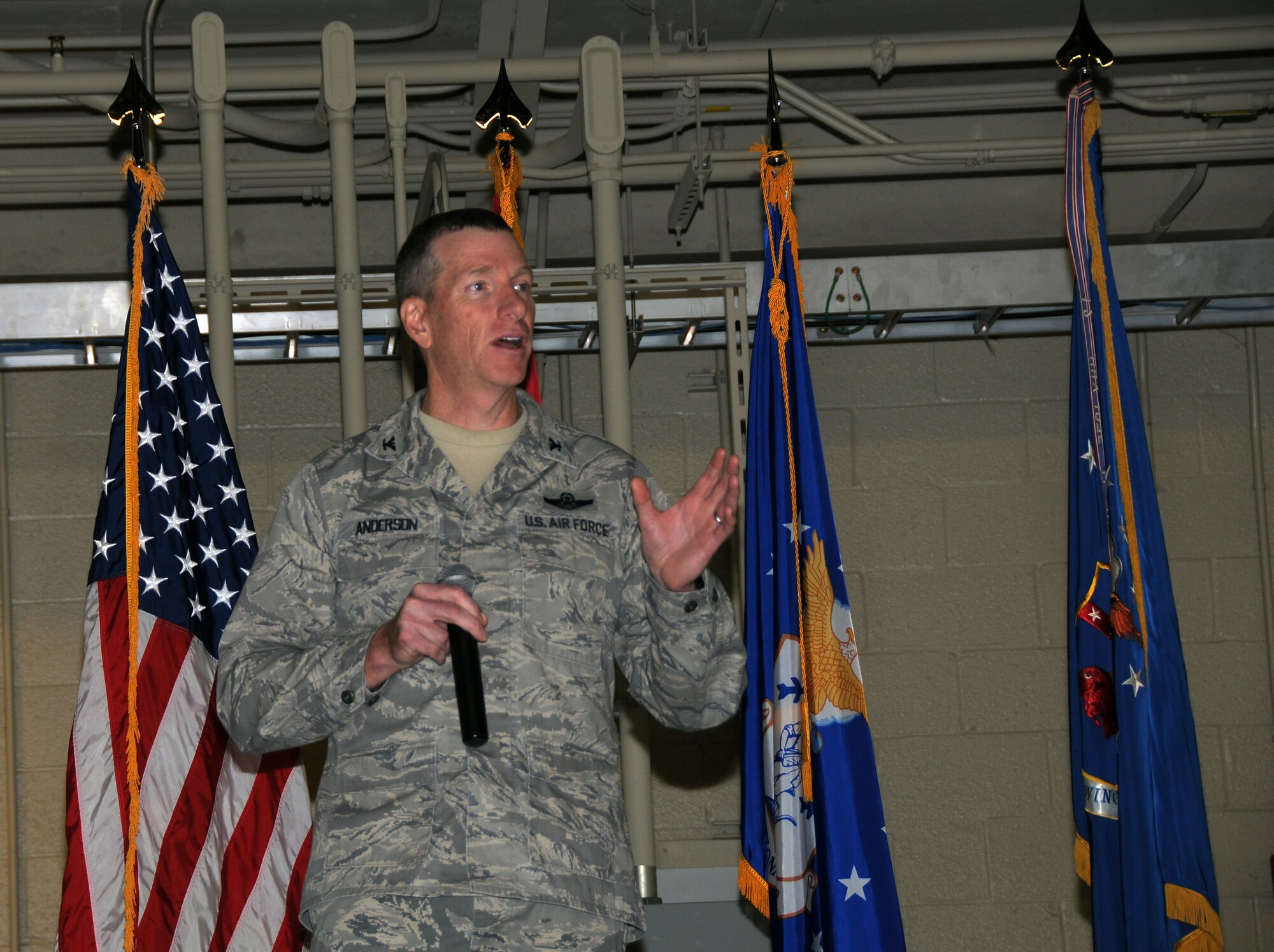Col. Mark W. Anderson, 188th Fighter Wing commander, gives a new mission briefing at the wing’s 60th anniversary celebration Nov. 2, 2013. The 188th hosted a 60th anniversary jubilee in its main hangar to celebrate 60 years of excellence. The 188th marked 60 years as an Air National Guard unit Oct. 15. The unit began as the 184th Tactical Reconnaissance Squadron in 1953. Current and former unit members as well as Congressional, city and civic leaders attended the event. (U.S. Air National Guard photo by Senior Airman John Hillier/188th Fighter Wing Public Affairs)