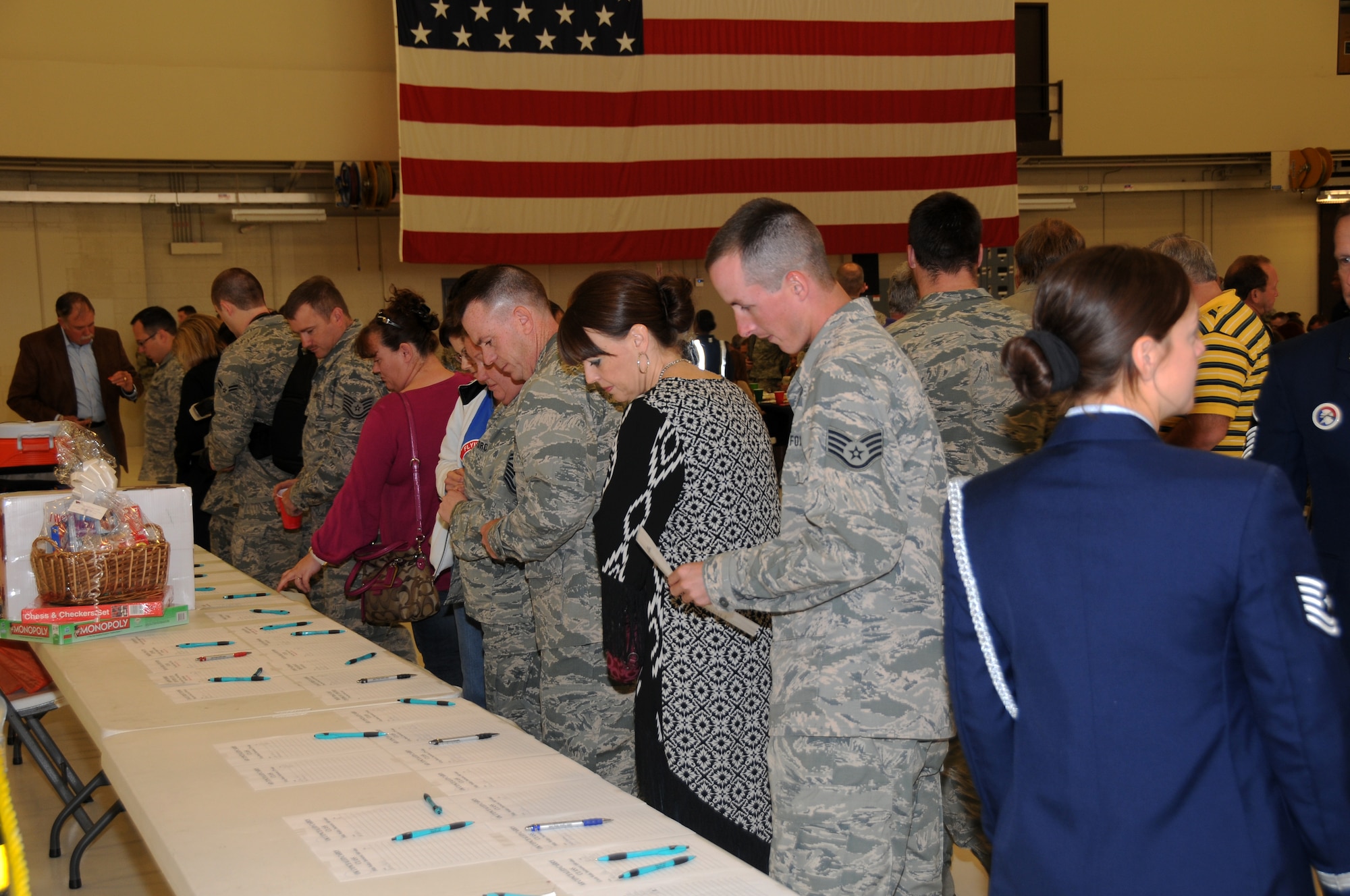 Airmen with the 188th Fighter Wing visit at the wing’s 60th anniversary celebration Nov. 2, 2013. The 188th hosted a 60th anniversary jubilee in its main hangar to celebrate 60 years of excellence. The 188th marked 60 years as an Air National Guard unit Oct. 15. The unit began as the 184th Tactical Reconnaissance Squadron in 1953. Current and former unit members as well as Congressional, city and civic leaders attended the event. (U.S. Air National Guard photo by Airman 1st Class Cody Martin/188th Fighter Wing Public Affairs)