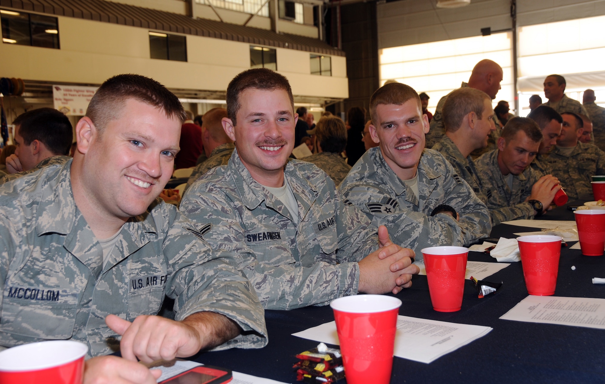 Airmen with the 188th Fighter Wing visit at the wing’s 60th anniversary celebration Nov. 2, 2013. The 188th hosted a 60th anniversary jubilee in its main hangar to celebrate 60 years of excellence. The 188th marked 60 years as an Air National Guard unit Oct. 15. The unit began as the 184th Tactical Reconnaissance Squadron in 1953. Current and former unit members as well as Congressional, city and civic leaders attended the event. (U.S. Air National Guard photo by Airman 1st Class Cody Martin/188th Fighter Wing Public Affairs)
