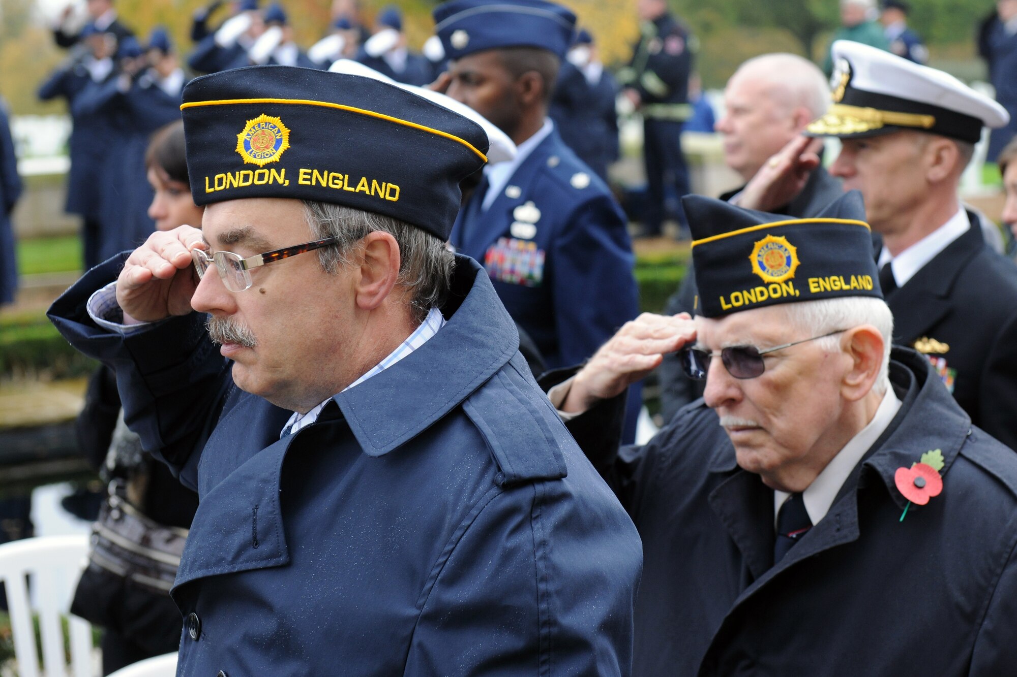 CAMBRIDGE, United Kingdom – Members of the American Legion in London, England, salute during the playing of “Taps” during the Veterans Day ceremony at Cambridge American Cemetery, in Cambridge, United Kingdom, Nov. 11. The ceremony honored the veterans of both the United States and United Kingdom. (U.S. Air Force photo by Staff Sgt. Brian Stives)