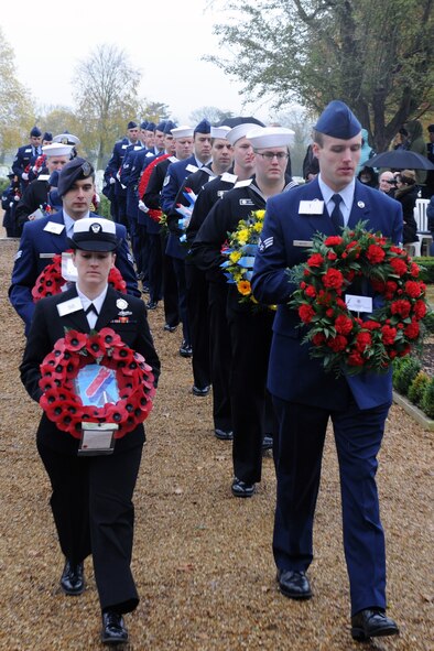 CAMBRIDGE, United Kingdom – Members of the 501st Combat Support Wing and its Mission Partners walk up to the base of the Tablets of the Missing in Cambridge American Cemetery, in Cambridge, United Kingdom, Nov. 11 during a Veterans Day ceremony. The ceremony honored the veterans of both the United States and United Kingdom. (U.S. Air Force photo by Staff Sgt. Brian Stives)