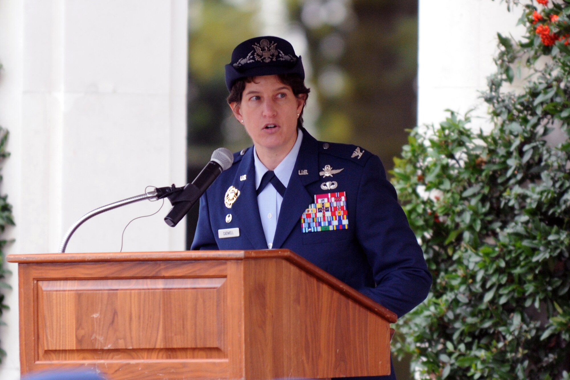 CAMBRIDGE, United Kingdom – Col. Angela Cadwell, 501st Combat Support Wing commander, talks about how members of the Eighth Air Force led the strategic bombing and escort duties for the American war effort in World War II while the Ninth Air Force led efforts to support the landings in Normandy during a Veterans Day ceremony at Cambridge American Cemetery, in Cambridge, United Kingdom, Nov. 11. “To all those who have served and are serving, we say thank you,” said Cadwell. “Thank you for your sacrifices, your sense of duty and your service. Our nation salutes you on this Veterans Day.” (U.S. Air Force photo by Tech. Sgt. Chrissy Best)