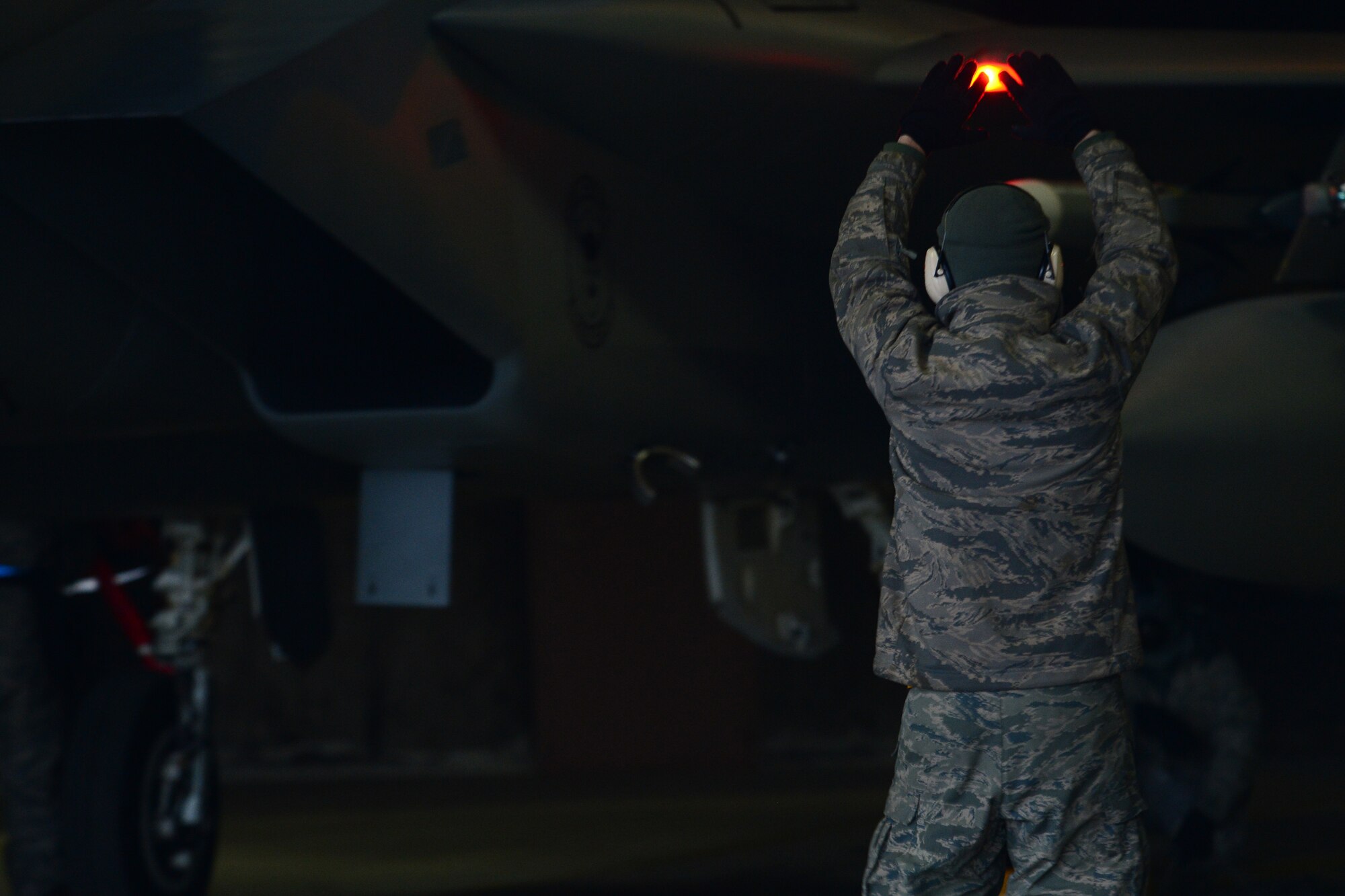 Senior Airman Kyle Eisler, 493rd Expeditionary Fighter Squadron crew chief, marshals an F-15C Eagle piloted by Lt. Col. Lendy Renegar, 48th Air Expeditionary Group commander, at Keflavik International Airport, Iceland, Nov. 6, 2013, to conduct air surveillance and policing missions. Airmen from Royal Air Force Lakenheath, RAF Mildenhall, Spangdahlem Air Base, Ramstein AB, Davis-Monthan Air Force Base, Tinker AFB and Robins AFB arrived at Keflavik International Airport, Iceland, Oct. 28, 2013, to complete an air surveillance exercise in support of a bilateral agreement between the U.S. and Iceland. (U.S. Air Force photo by Airman 1st Class Dana J. Butler/Released)