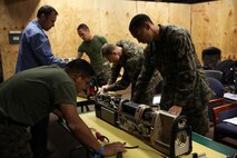 Sailors with Medical Logistics Company, Combat Logistics Regiment 25, 2nd Marine Logistics Group conduct maintenance training with Portable Patient Transport Life Support System devices aboard Camp Lejeune, N.C., Nov. 5, 2013. The purpose of the training was to familiarize the sailors with proper maintenance procedures for the PPTLSS device.