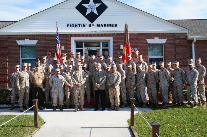 Marines with 6th Marine Regiment, 2nd Marine Division headquarts pose with Medal of Honor Holder, Maj. Gen. James E. Livingston (retired). Livingston is a former commander of the 6th Marine Regiment.