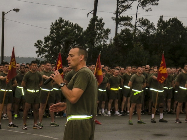 Colonel Ryan P. Heritage, the commanding officer of 6th Marine Regiment, 2nd Marine Division speaks to his Marines and sailors after a motivational run to celebrate the Marine Corps' 238th Birthday.
