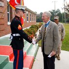 Major Gen. James E. Livingston (retired), greets a Marine in front of the 6th Marine Regiment headquarters building. Livingston, a Medal of Honor holder, is a former commander of the 6th Marine Regiment.