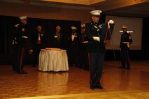 Capt. Landon Dunaway, Recruiting Station Kansas City executive officer, reads Maj. Gen. John A Lejeune's, 13th Commandant of the Marine Corps, birthday message during the 238th birthday celebration of the Marine Corps at the Arogsy Hotel and Casino ballroom Nov. 8, 2013. The guest speaker for the ball was retired Air Force Lt. Col. Barry B. Bridger, a former F-4 Phantom and Vietnam POW, who commented on his experiences as a POW during the war.