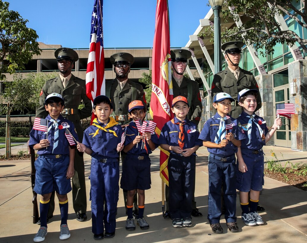 Members of the Anaheim Cub Scout Pack #546 pose for pictures with the 15th Marine Expeditionary Unit color guard during a Veterans Day ceremony outside City Hall in Anaheim, Calif., Nov. 9. Lieutenant Col. John R. O’Neal, commanding officer, 15th MEU, served as the keynote speaker during the ceremony, which included addresses by local leaders and a cake cutting celebration in honor of the Marine Corps’ 238th birthday. (U.S. Marine Corps Photo by Cpl. Emmanuel Ramos/Released)