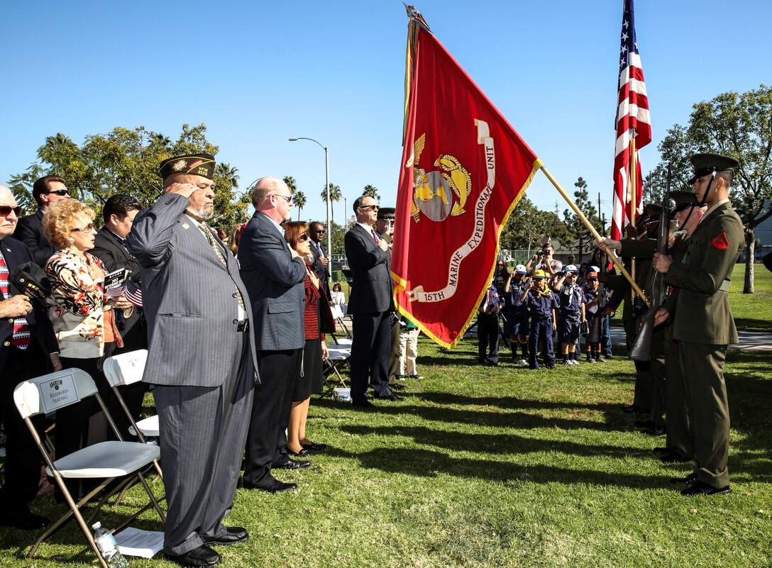 The 15th Marine Expeditionary Unit color guard presents the colors during a Veterans Day ceremony outside city hall in Anaheim, Calif., Nov. 9. Lieutenant Col. John R. O’Neal, commanding officer, 15th MEU, served as the keynote speaker during the ceremony, which included addresses by local leaders and a cake cutting celebration in honor of the Marine Corps’ 238th birthday. (U.S. Marine Corps Photo by Cpl. Emmanuel Ramos/Released)