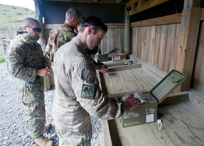 Pvt. Reuben Ellett, signaler with 2 Signal Squadron, New Zealand Defence Force, from Tauranga, New Zealand, receives ammunition prior to a familiarization shooting range with the Individual Weapon (IW) Steyr assault rifle during the initial stages of exercise Southern Katipo 2013 at Waiouru Military Camp, New Zealand, Nov. 7. SK13 increases the ability of all participants to coordinate in complex situations.   