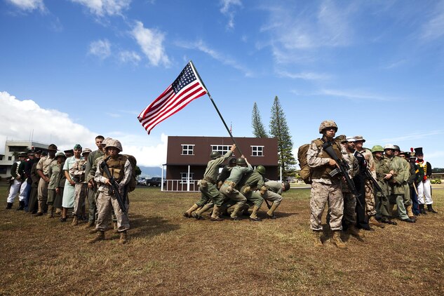 Marines with Headquarters Battalion gather in a display of historical pageantry, after a dress rehearsal for the annual Marine Corps Base Hawaii at Dewey Square, Nov. 6, 2013. The uniforms replicate those worn in the periods ranging from the Revolutionary War to the current MARPAT utilities. Each of the uniforms highlights the evolution of the Marine Corps from past to present, showing we still carry the same values and traditions today as we did when it was born in Tun Tavern, Pa. (U.S. Marine Corps photo by Lance Cpl. Matthew Bragg)